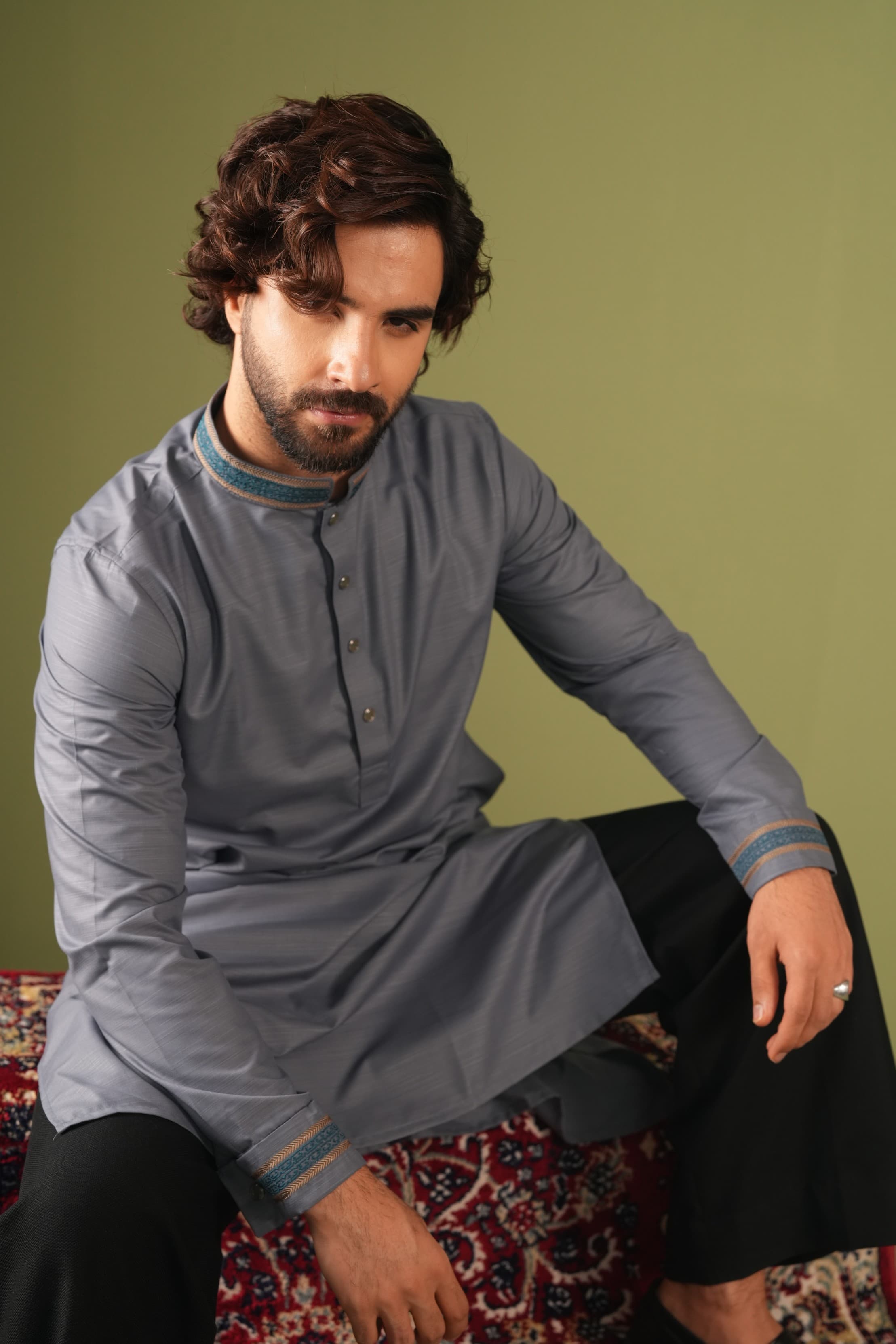 Model wearing a white embroidered kurta