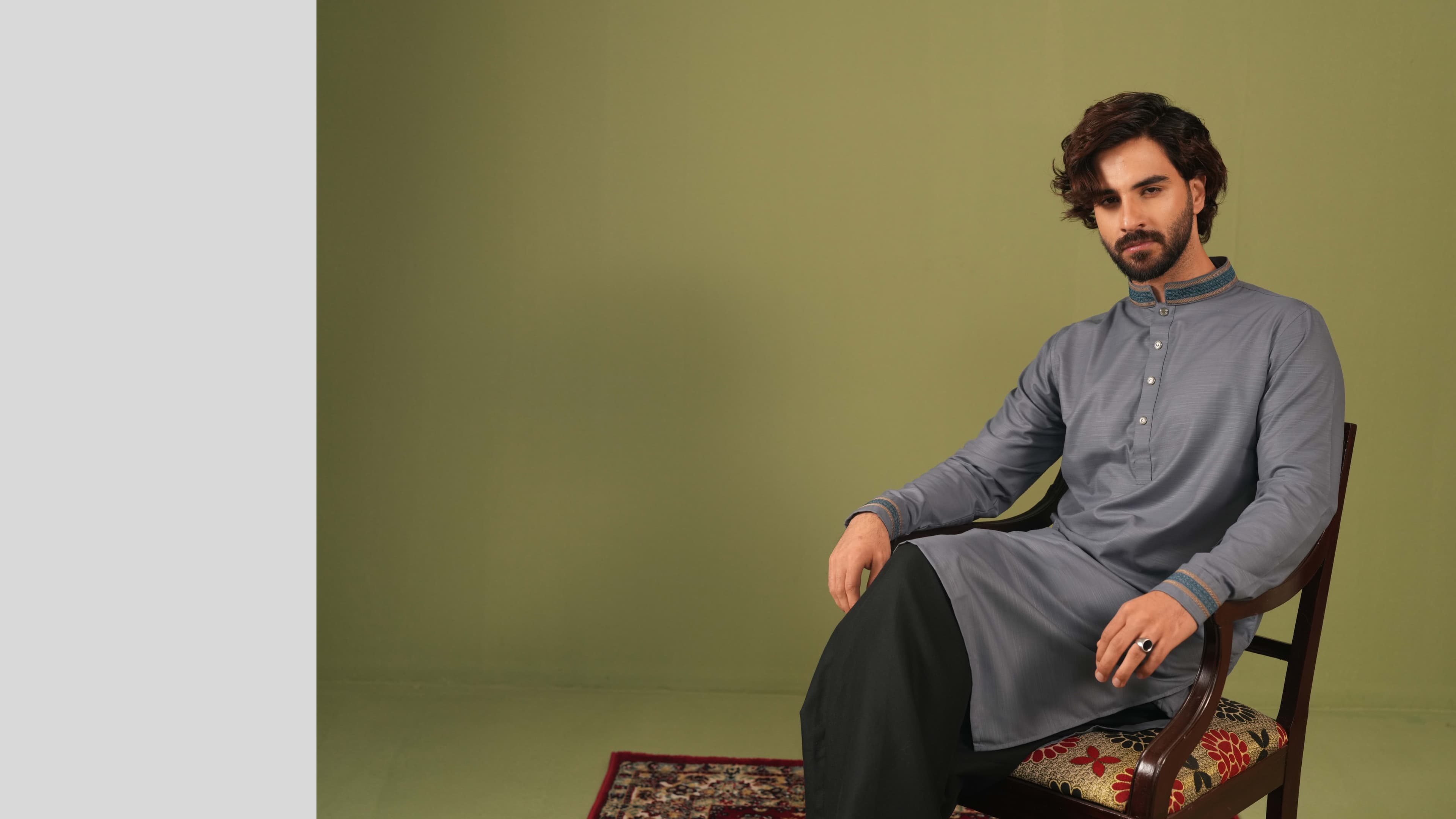 Model wearing a white embroidered kurta